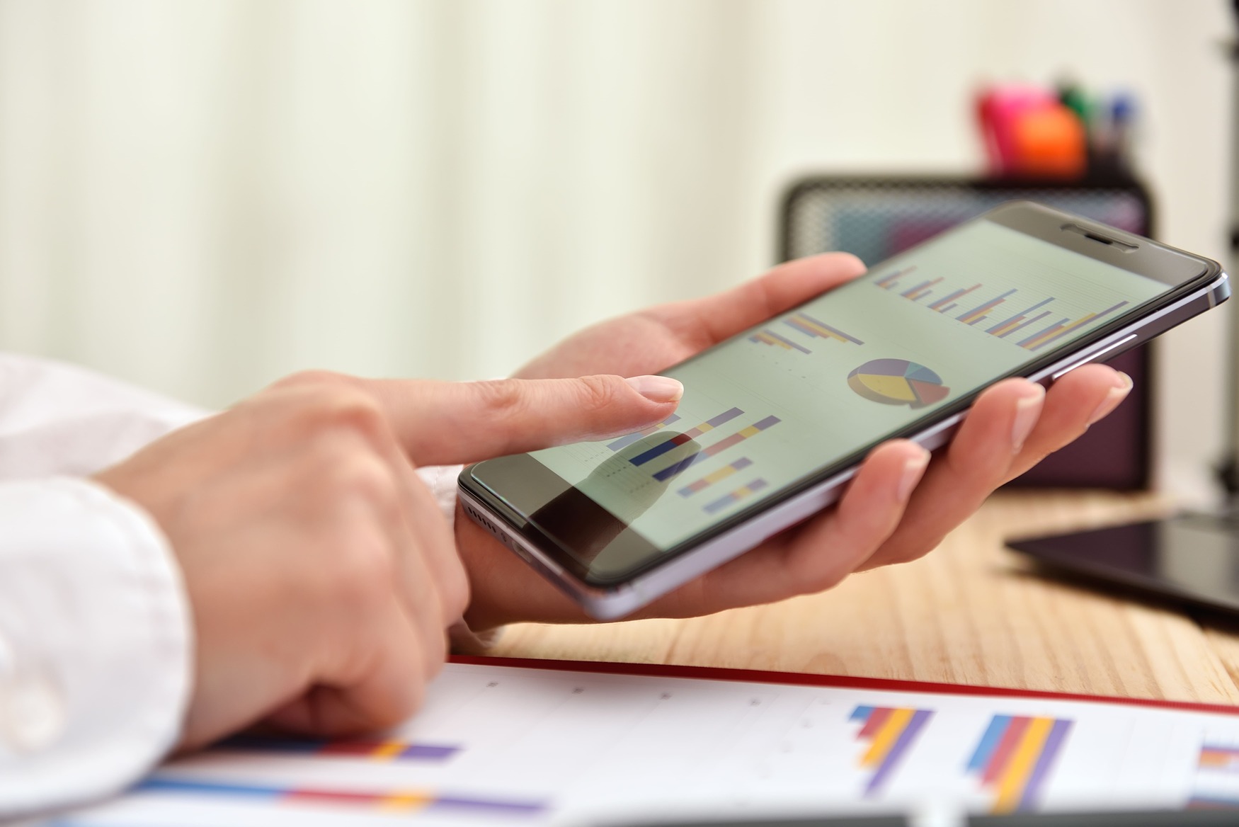 A person using a mobile application to track daily expenses and manage a budget